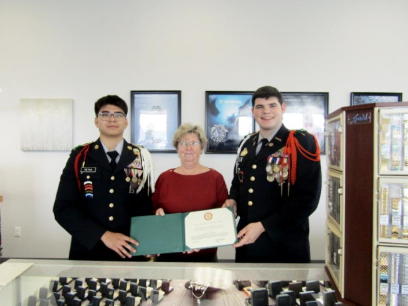 Cape High JROTC Cadet Sgt. Major Diego Reyna, left, and Cadet Battalion Commander Isaac League present Pam Brittingham of Fifth Avenue Jewelers with the U.S. Army Patriotic Service Award. SUBMITTED PHOTO